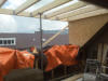 Balkenlaag dakkapel op zolder (met regenbuitje)